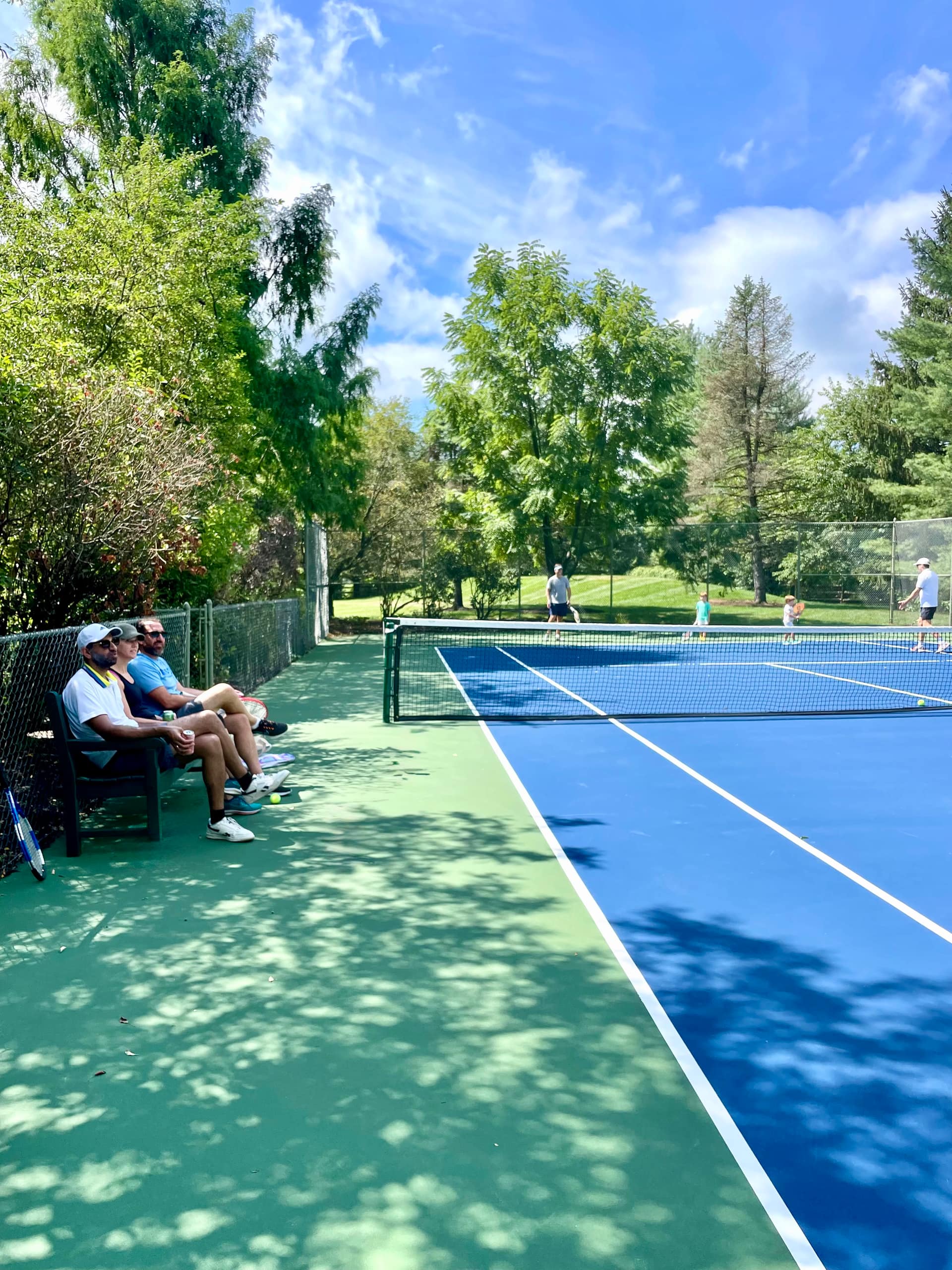 Players on the private court at New Hope Tennis Club